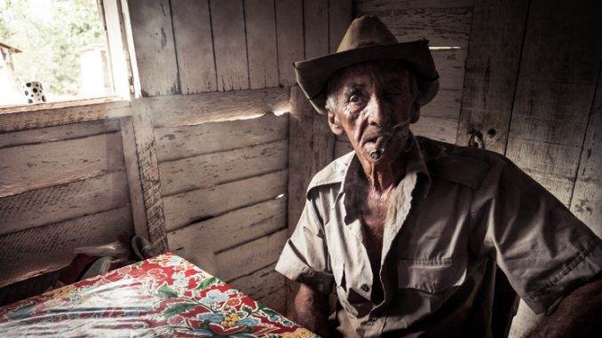 Tobbaco worker in his hut at Trinidad