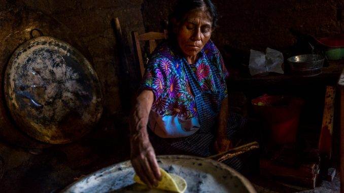Cooking hand-made tortillas at home in Zinacantan, Chiapas