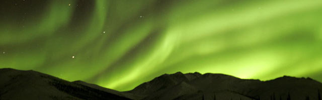 Image of the green lights of the Aurora Borealis by Andy Long.