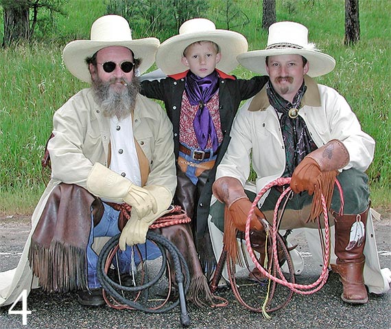Photo of cowboys holding whips near Evergreen, Colorado by Jim Austin.