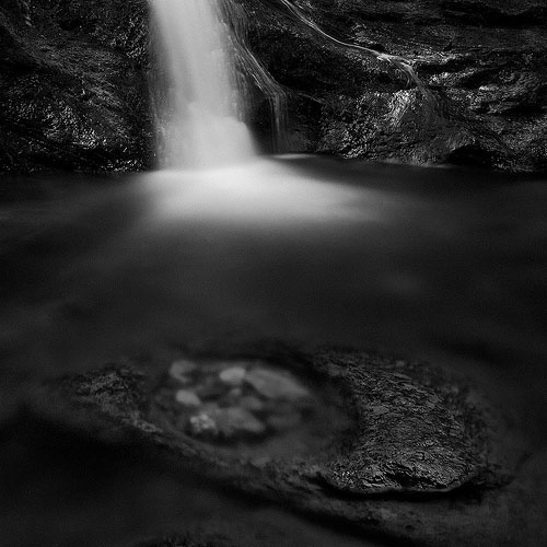 Black and white photo of Ninglinspo Waterfall in Belgium by Geoffrey Gilson.