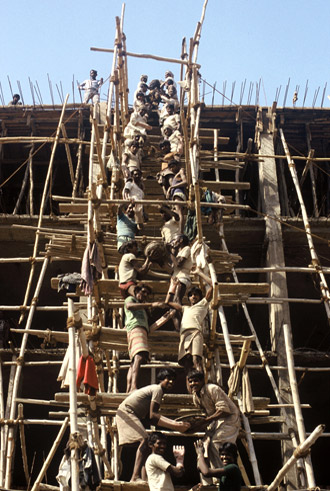Photo of workers on scaffold in New Dehli, India by Ron Veto