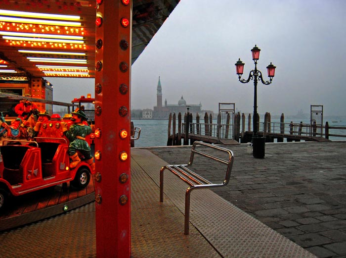 Photo of red carousel and foggy Venetian background by Gert Wagner