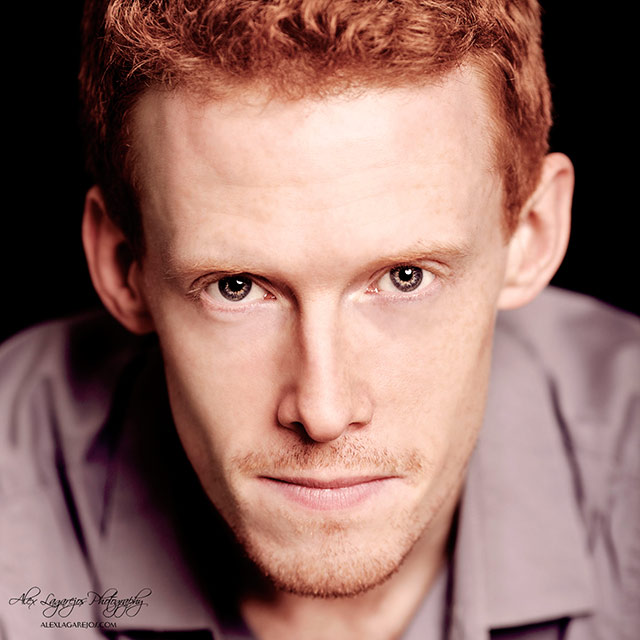 Close-up headshot of a red haired man looking straight into the camera by Alex Lagarejos.