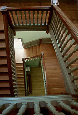 Wood staircase with the element of lines coming from different directions by Andy Long.