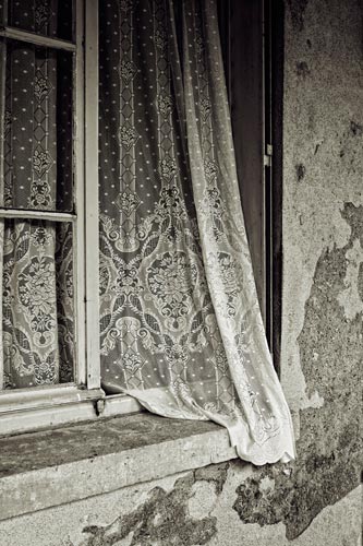 Photo of curtain hanging out window in Paris, France by Randy Romano