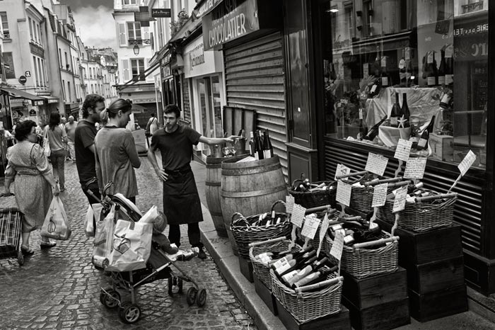 Photo of wine vendor on street in Paris, France by Randy Romano