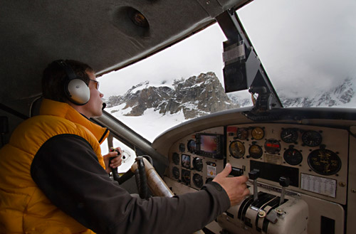 Photo of pilot landing Talkeetna Air Taxi on glacier of the Alaskan Mountain Range by Barry Epstein