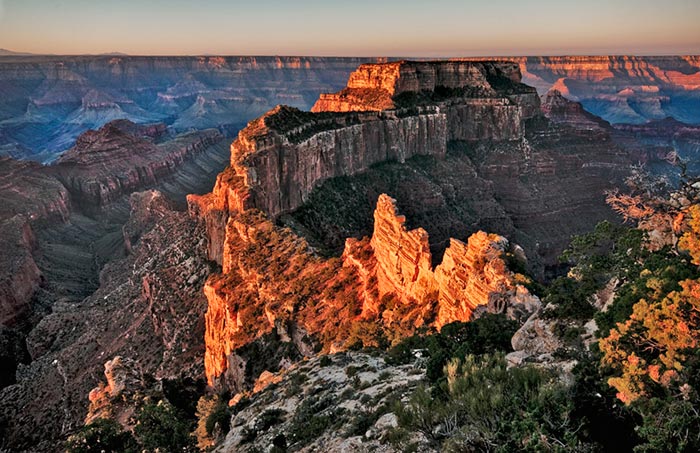 Autumn color photo at sunrise from north rim of Grand Canyon, Arizona by Robert Hitchman