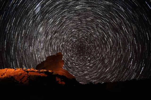 Star Stacking: Light painted on forground rock formations and stars in circular pattern at Valley of the Gods, Utah by Andy Long.