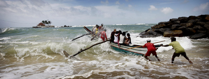 Photo of boat launching on the shores in Hikkaduwa by Marielle van Uitert