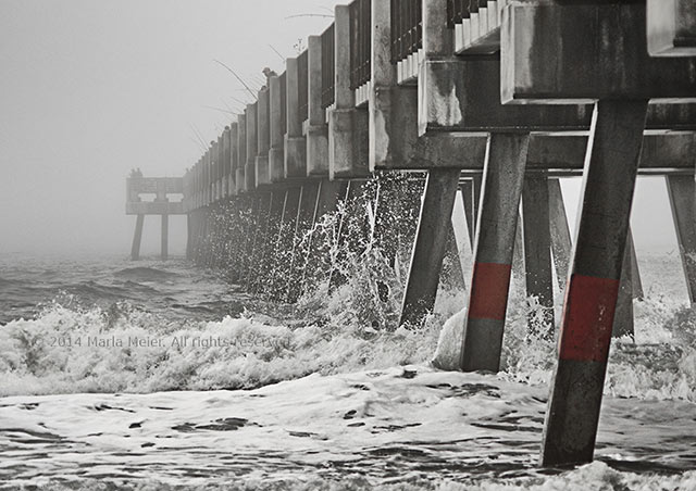 Black and white photo of the Jacksonville Beach, Florida pier in the fog by Marla Meier.