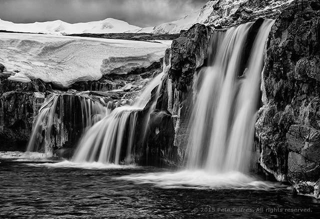 Black and white photo of Kirkjufellsfoss Waterfalls by Pete Scifres.