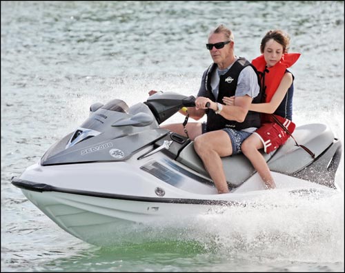Photo of man and boy on jet ski from Emotion in Motion ebook by Jim Austin