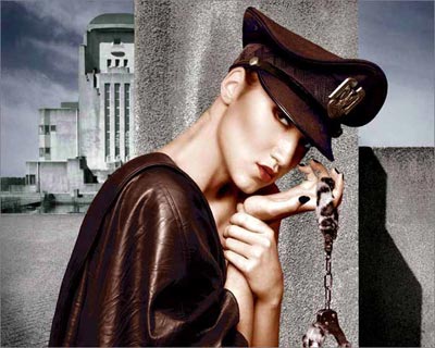 Photoshop colored photo of female model dressed in retro style leather jacket with handcuffs from the retro series by Juul de Vries.
