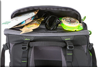 Image of personal items in the open top pocket of the MindShift Gear’s rotation180°® Trail™Backpack by MindShift Gear.
