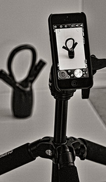 Image of smartphone mounted on a tripod in a studio setting by Allen Moore.