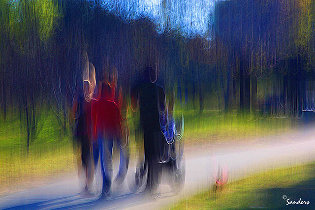 Photo Impressionism technique: image of people in a tree lines park using camera shake to create an impressionistic effect by Gerald Sanders.