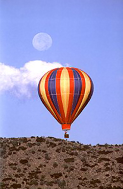 Full moon photography: early morning moon image with hot air balloon in the foreground by Andy Long.