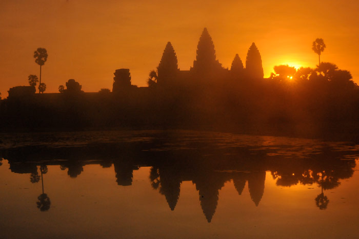 Silhouette photo of landscape reflected on water in Angkor Wat, Cambodia by Ron Veto