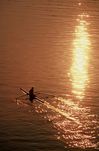 Silhouette photo of rower sculling on Potomac River in Virginia by Ron Veto