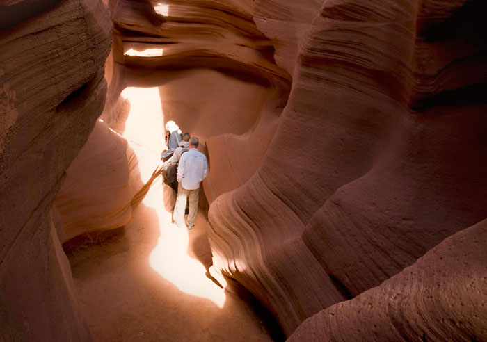 Photo of rock formations and people touring in the lower canyon of Antelope Canyon by Piero Leonardi