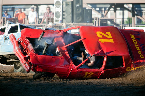 Stop action photography: Crashed cars at demolition derby by Brad Sharp.