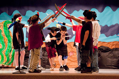 Stop action photography: Children perfoming in school play by Brad Sharp.