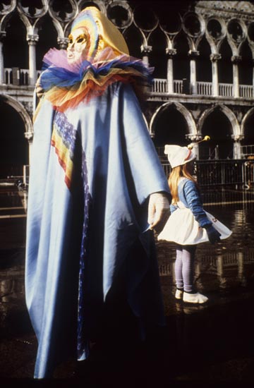 Photo of people in costumes & masks at the Venetian Carnival by Piero Leonardi