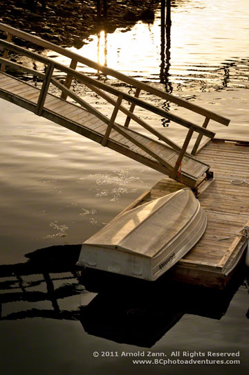 Photo of row boat on dock in mid-coast, Maine by Arnold Zann.