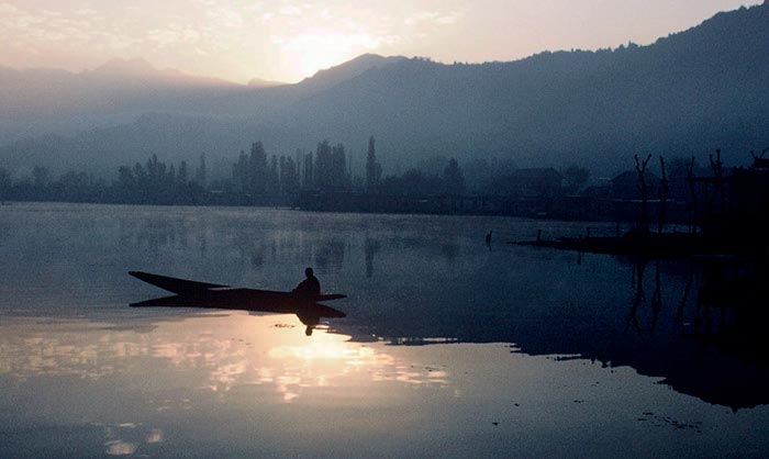 Photo of boat on Dal Lake in Kashmir, India by Ron Veto