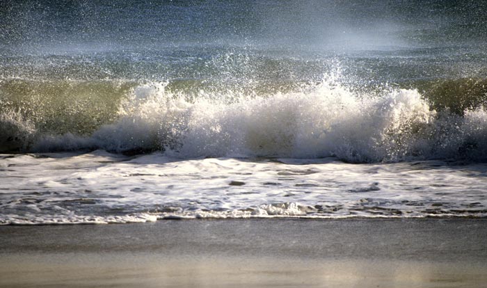 Photo of ocean wave and spray at the beach by Noella Ballenger