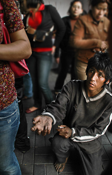 Tips for a Career in Photojournalism: Photo of street begger in Peru by Michelle Wong