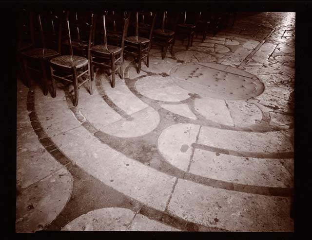 Black and white photo of a Maze in the stone floor at Chartres, France by Linda Connor.
