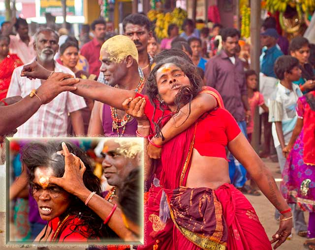 Dasara festival in India: women in red among the crowds is in a trance-like state by Kris Hariharan.