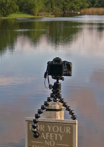 Image of Joby GorillaPod Focus and Ballhead X attached to sign post at lake during sunset by Marla Meier.