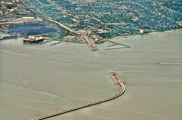 Aerial photo of the James River where the underwater tunnel disappears under the water in Norfolk, Virginia by Allen Moore.