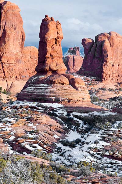 Snow compliments the red rock formations in the Garden of Eden at Arches National Park by Andy Long.