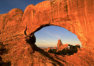 Image of Turret Arch - red rock formations at Arches National Park by Lee Watson.
